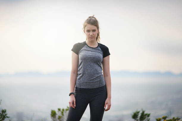 Portrait of a sporty young woman standing outdoors