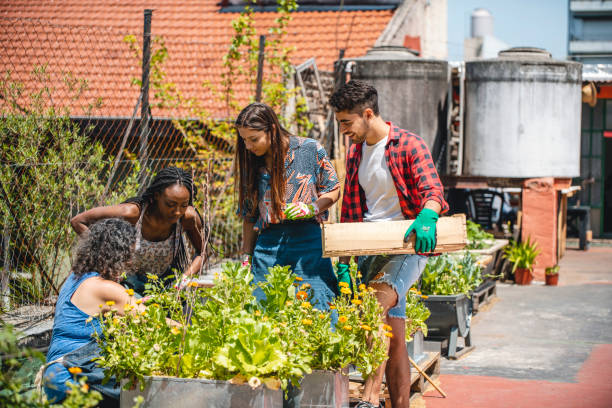 istock Mature Urban Gardener Working with Young Community Members 1189121146