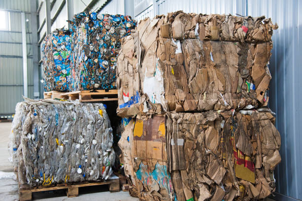 Russia, Krasnodar, April 10, 2019: a lot of extruded boxes from different companies. Processing of cardboard boxes into raw materials for further use in paper production. Waste sorting. Modern problems and solutions in ecology