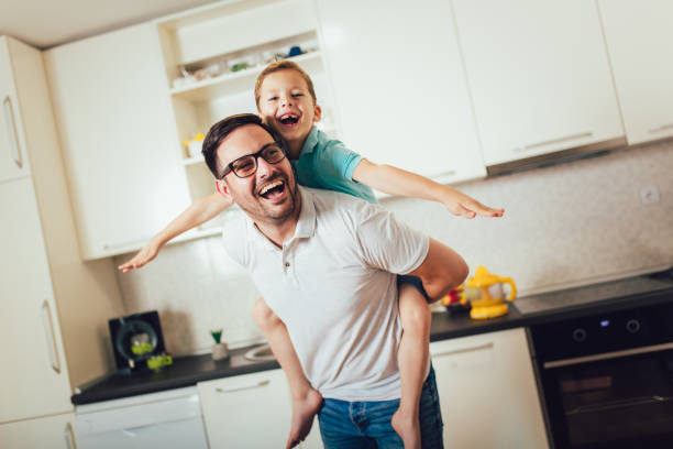 istock Father and son having fun at home. 1189122518