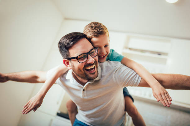 istock Father and son having fun at home. 1189122650