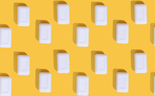 istock A lot of white soaps on yellow background. Colorful pattern. 1189123338