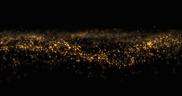 istock Gold glitter particles, shining gold sparks wave background. Gold glow and shimmering sparkles shine, abstract magic bright sparks in wave motion 1189123883