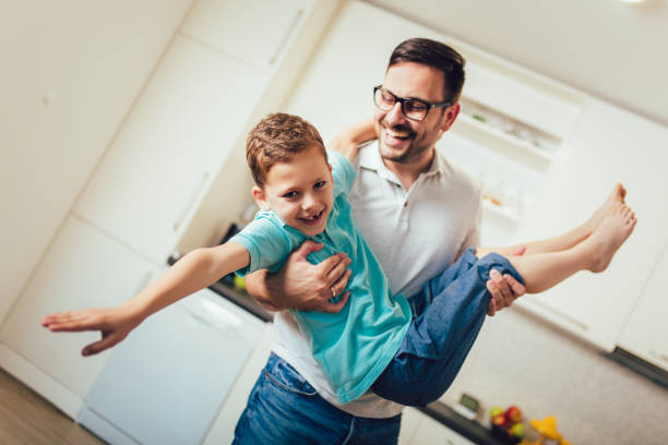 istock Father and son having fun at home. 1189124573