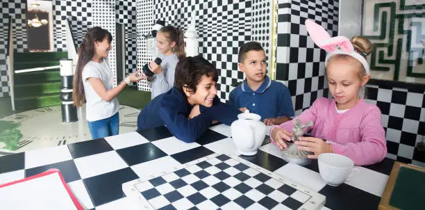 Photo of children play in the chess quest room