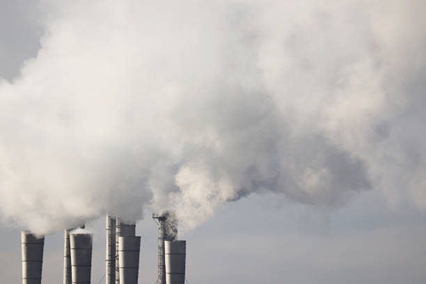 istock Air pollution, smoke from the chimneys on sky background 1189126976