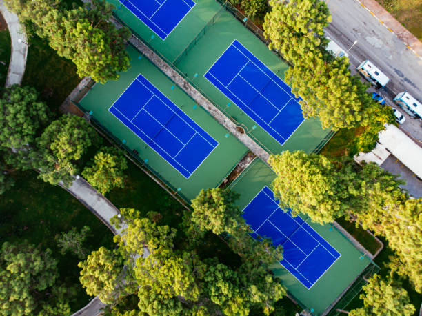 istock Aerial View Tennis Courts in the Forest 1189128361