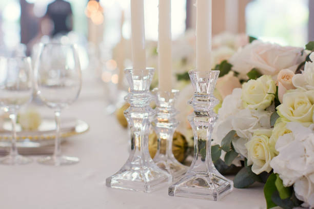 istock Beautiful table setting with flowers and candles 1189129237