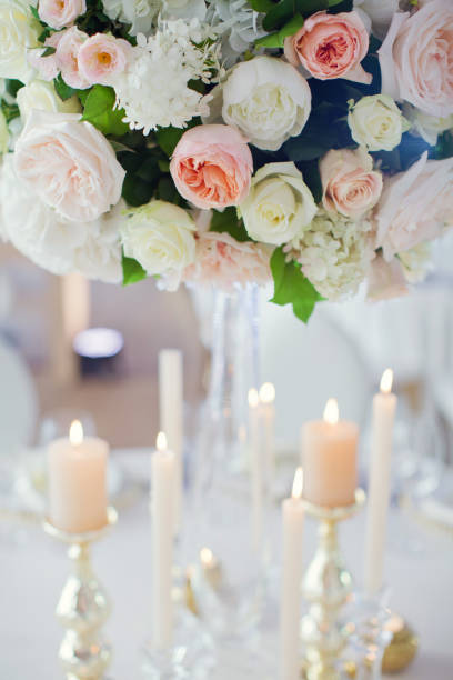 istock beautiful flowers compositions and candles 1189129297