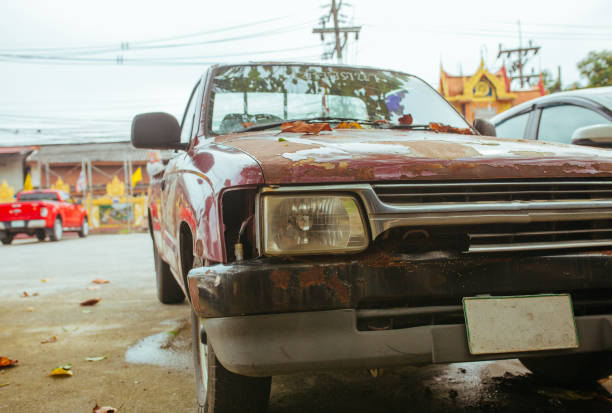 istock Old broken and rusty Car in summer Asia 1189129844
