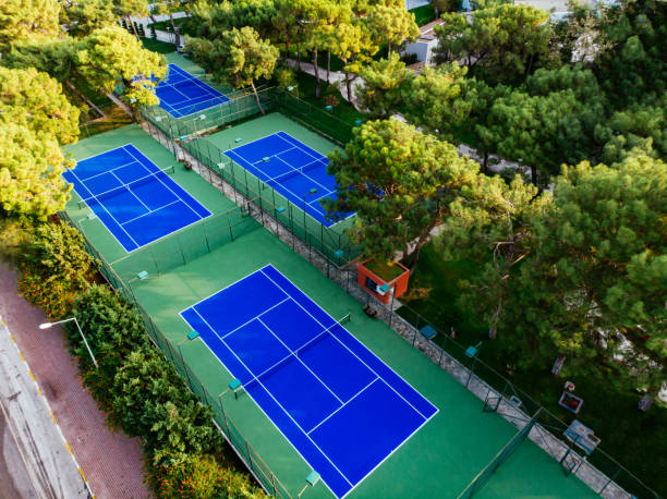 istock Aerial View Tennis Courts in the Forest 1189132475