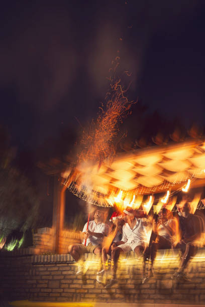 istock Friends making fireworks at New Years Eve party 1189133207