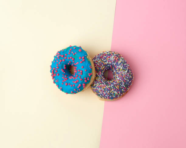 istock round baked donut with colored sugar sprinkles 1189133399