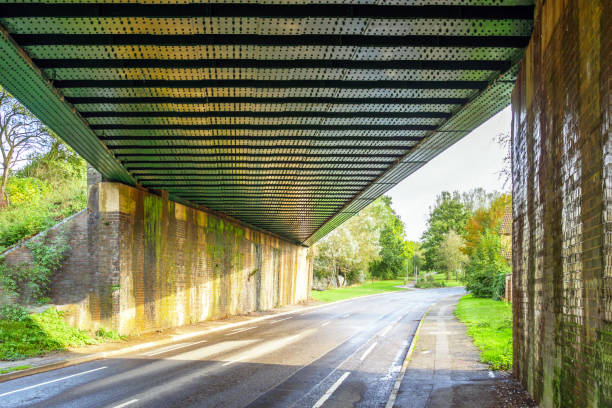 railway bridge with road underneath in england uk.