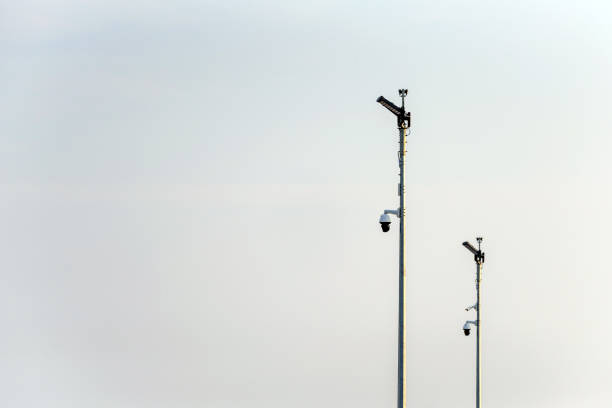 istock cctv cameras on metal stand over cloudy sky in uk 1189134448