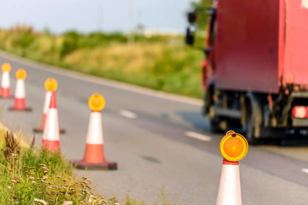 istock sunset view uk motorway services roadworks cones with red van passing 1189134552
