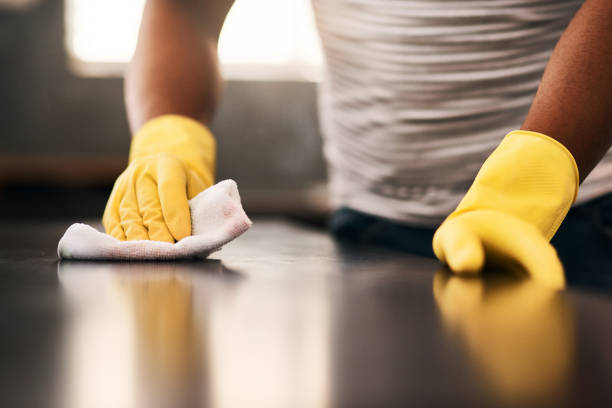 I'll keep wiping until its spotless Cropped shot of an unrecognizable man cleaning a kitchen counter at home surface disinfection stock pictures, royalty-free photos & images