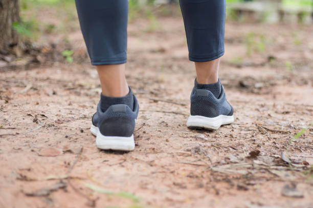 istock Female hands lacing running shoes. Closeup 1189135258