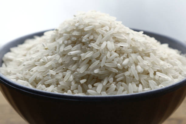 istock Bowl of raw rice on a table 1189135471