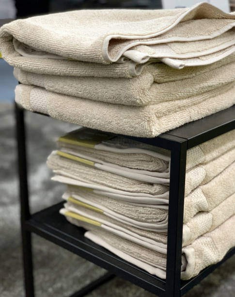 istock Towels folded in a pile on a shelf. 1189135840