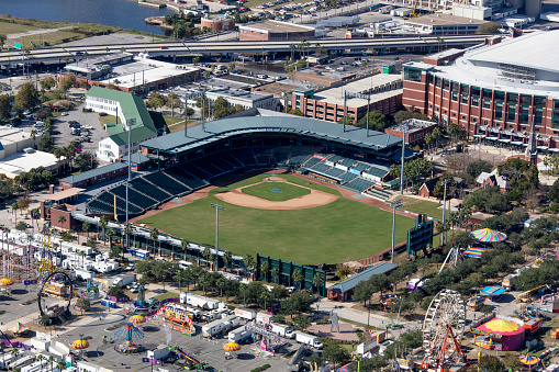 Houston, United States - April 13, 2023:  Minute Maid Park with the roof retracted; the home of Major League Baseball's Houston Astros located in downtown Houston, Texas shot from an altitude of about 500 feet at sunset.