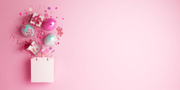 istock Winter abstract design creative concept, shopping bag, gift box, balloon,  snow icon confetti glitter scattering on pink background. Copy space text. 1189137907