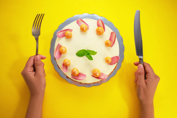 istock Homemade cake on yellow background 1189138501