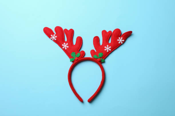 istock Red deer horns on blue background, space for text 1189140519