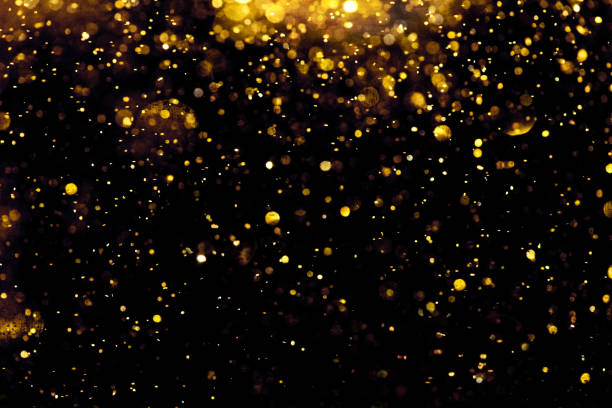 istock golden glitter bokeh lighting texture Blurred abstract background for birthday, anniversary, wedding, new year eve or Christmas 1189141923