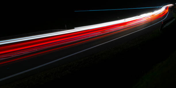 istock lights of cars with night 1189142038