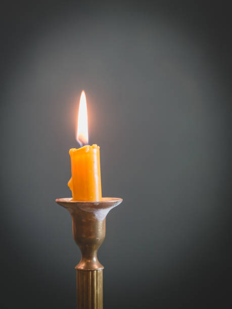 istock Burning candle, vintage bronze candlestick. 1189142195