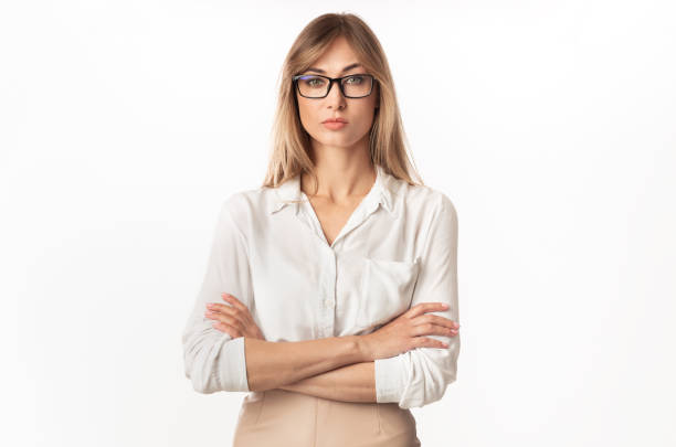 istock Serious Businesswoman Standing Crossing Hands On White Studio Background 1189142853