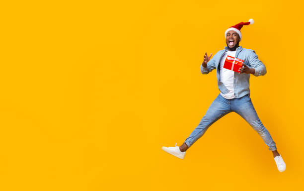 Funny Black Man Jumping With Christmas Gift Box Stock Photo - Download Image Now - Christmas, Studio Shot, Backgrounds - iStock Funny Black Man Jumping With Christmas Gift Box Stock Photo - Download Image Now - Christmas, Studio Shot, Backgrounds - iStock