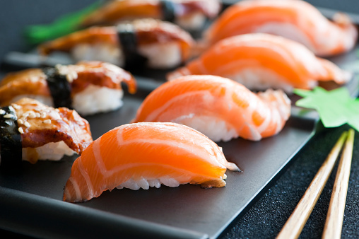Close up of salmon nigiri and unagi nigiri