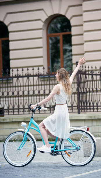 istock Pretty girl with a blue bike 1189143407