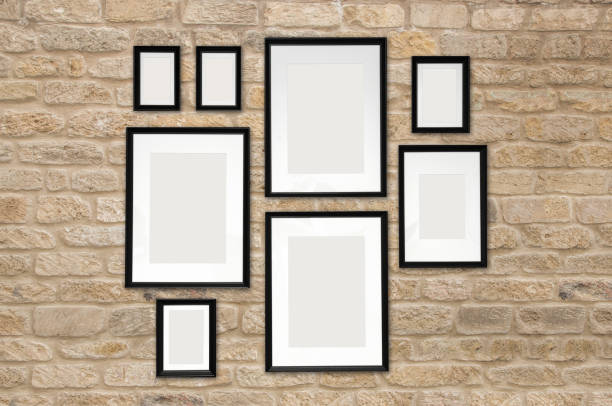 istock composition of 8 black photo frames on a brick wall background. empty white space for photos. mock up poster. 1189146302