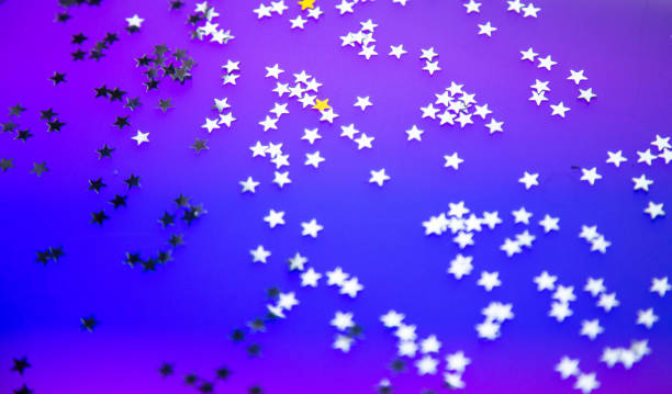 istock multi-colored lights garlands, festive background, shiny stars 1189146409
