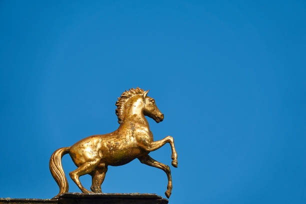 istock Golden horse sign on blue sky 1189147074