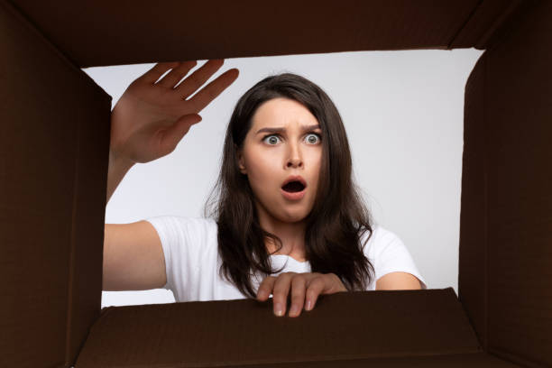 istock Shocked Young Woman Looking Into Empty Box, Bottom View 1189148745