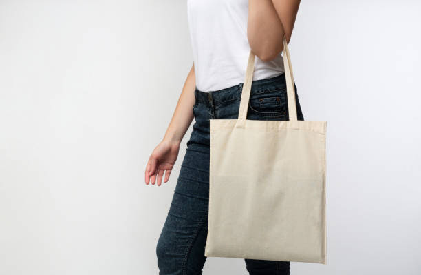 istock Unrecognizable Woman Carrying White Blank Eco Bag In Studio, Cropped 1189148764