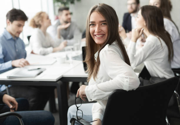 istock Happy business lady smiling to camera during meeting 1189149083