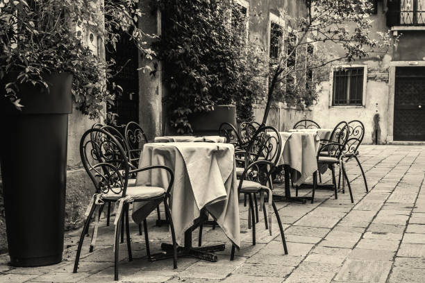Tables and chairs in a small square in Venice, Italy
