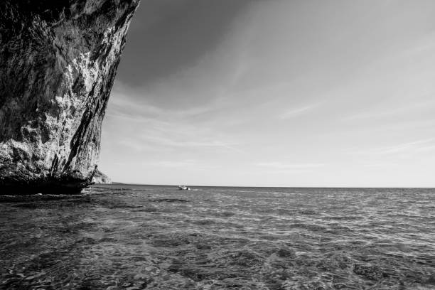 istock Sailing by a huge cliff in Sardinia 1189150450