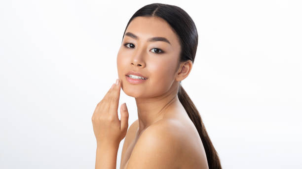 istock Face lifting concept. Young woman touching soft smooth skin 1189150704