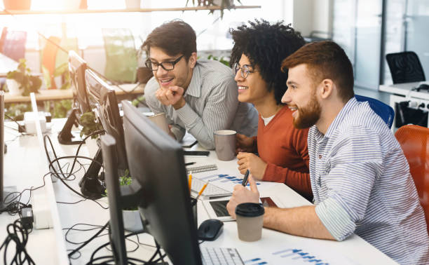 istock Male team of program engineers working at office 1189154147