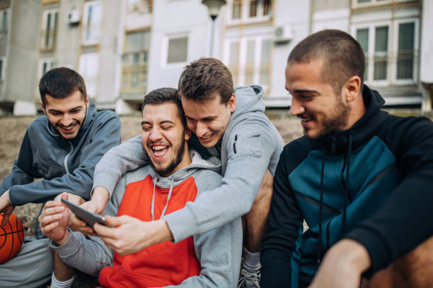 istock Group of young adults plays basketball 1189154155