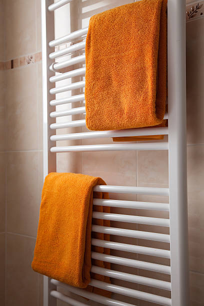 istock orange towels on heater 118915528