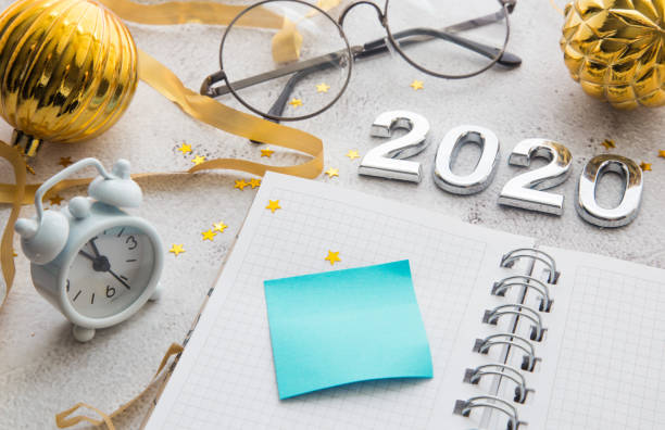istock Office desktop top view. Notepad and Christmas decorations. Planing Calendar 2020. 1189155795