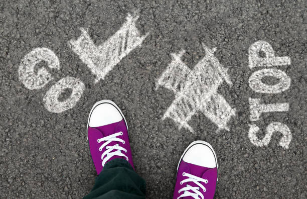 istock Girl in purple sneakers deciding to move forward 1189155919