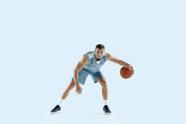 istock Young caucasian basketball player against white studio background 1189156693